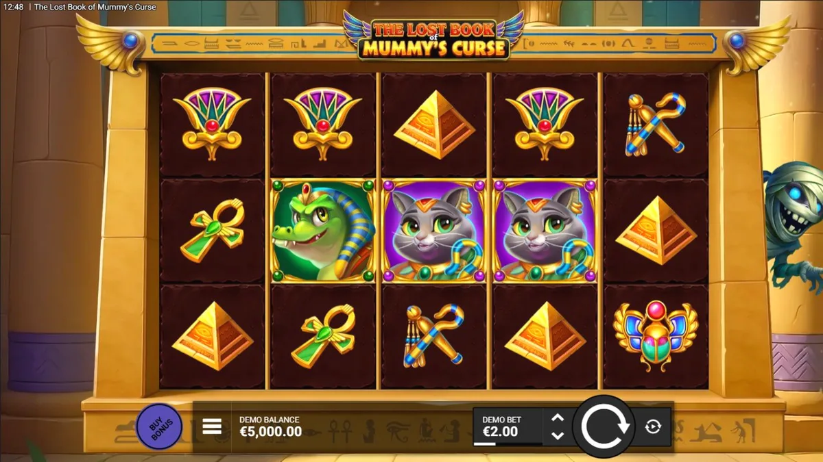 Tampilan visual slot The Lost Book of Mummy’s Curse dengan tema Mesir kartun